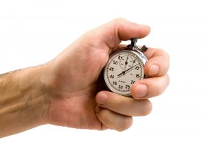 Hand starts stop watch to measure response time