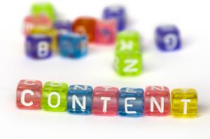 Colorful blocks spell out the word "content" with blurry blocks in background